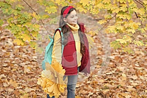 autumn kid fashion. romantic season for inspiration. happy childhood. back to school. teenage girl with backpack hold