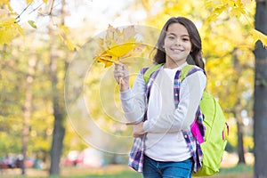 Autumn kid fashion. romantic season for inspiration. happy childhood. back to school. teenage girl with backpack relax