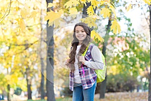 Autumn kid fashion. romantic season for inspiration. happy childhood. back to school. teenage girl with backpack relax