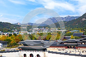 Autumn of Korean tradition architectural of Gyeongbokgung palace and modern building cityscpae modern office view background, photo