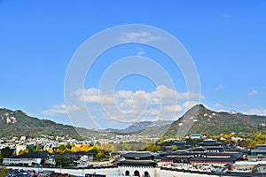 Autumn of Korean tradition architectural of Gyeongbokgung palace and modern building cityscpae modern office view background, photo