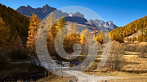 Autumn in La Claree Valley with La Souchere Bridge in the Cerces Massif mountains, Hautes-Alpes, Alps, France