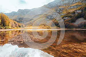 autumn lake landscape with reflection, Italy