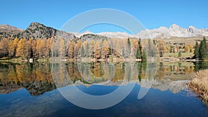 Autumn lake near San Pellegrino Pass, Trentino, Dolomites Alps, Italy.