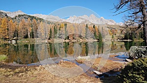 Autumn lake near San Pellegrino Pass, Trentino, Dolomites Alps, Italy.