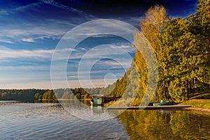 Autumn lake on a sunny day, water mirror