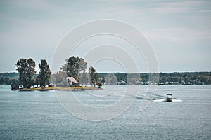 Autumn landscape in the 1000 islands. Houses, boats and islands. Lake Ontario, Canada USA