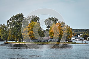 Autumn landscape in the 1000 islands. Houses, boats and islands. Lake Ontario, Canada USA