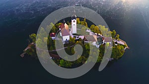 Autumn landscape. Aerial sunset view of island and church of Assumption in Lake Bled, Slovenia