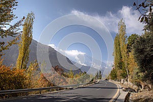 Autumn landscape background with fall colours trees in northern areas of Pakistan