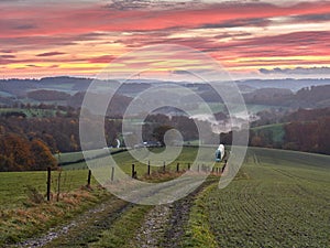 Autumn landscape in the Bergisches Land region in the German city of Velbert. The fiery red sky. Rural landscape before sunrise