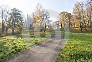 Autumn landscape, a Catholic chapel among the trees with yellow