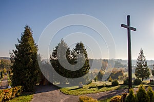 autumn landscape. Catholic cross on the background of a clear sky. heaven on earth