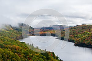 Autumn landscape with colorful foliage and mountain lake