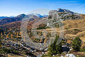 Autumn landscape in Dolomites, Italy. Mountains, fir trees and above all larches that change color assuming the typical yellow aut