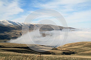 Autumn landscape, fields and meadows, snow-capped mountains and hills of Armenia