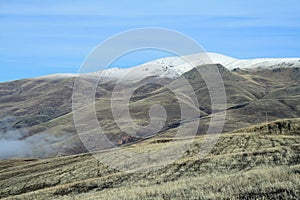 Autumn landscape, fields and meadows, snow-capped mountains and hills of Armenia