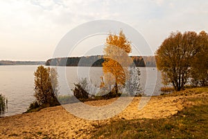 Autumn landscape with fisherman