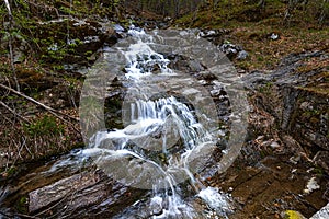 Autumn landscape of flowing cascade water