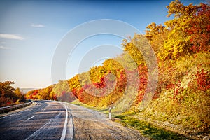 Autumn landscape with mountain road turn