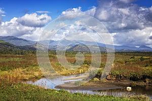 Autumn landscape with a river. Kunashir Island, Southern Kuriles