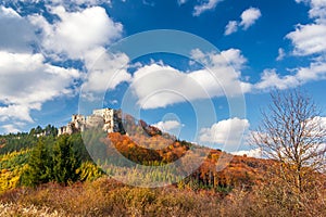 Autumn landscape with ruin of medieval castle Lietava.