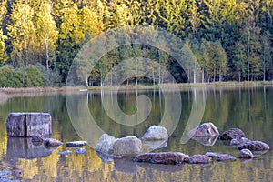 Autumn landscape. Saint Ana lake in Romania, the only volcanic lake in Europe, formed in a crater of a dead volcano