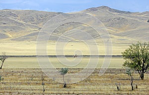 Autumn landscape, steppe with mountains. prairie, veld, veldt. a