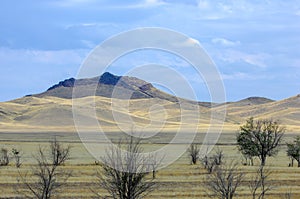 Autumn landscape, steppe with mountains. prairie, veld, veldt. a