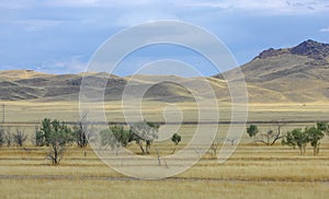 Autumn landscape, steppe with mountains. prairie, veld, veldt. a