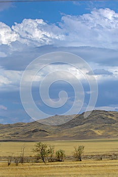 Autumn landscape, steppe with mountains. prairie, veld, veldt. a