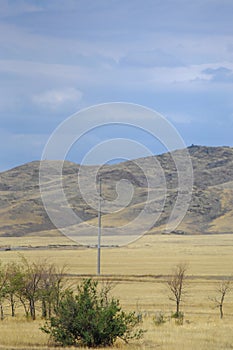 Autumn landscape, steppe with mountains. prairie, veld, veldt. a