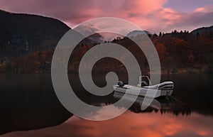 Autumn Landscape  With Two White Boats Of The Rescue Service Against The Backdrop Of The Reflection Of  Triglav Mountains,  Fiery