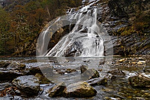 autumn landscape view of the Cascata delle Sponde waterfall near Someo in the Ticino in Switzerland photo