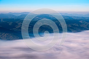 Autumn landscape view of mountain hills above misty clouds, Slov