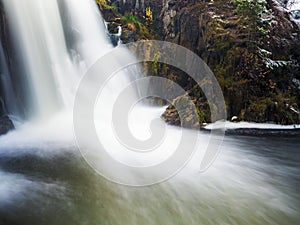 Autumn landscape with the waterfall