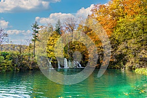 Autumn landscape with waterfall in Plitvice