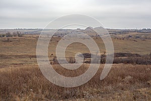 Autumn lanscape in the steppes with slagheap