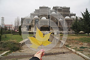 Autumn leaf and The National Library of Kosovo is located in Pristina, Kosovo