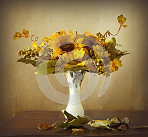 Autumn leaves and dried sunflowers