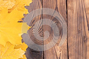 Autumn leaves frame on wooden background top view Fall Border yellow and Orange Leaves vintage wood table Copy space for