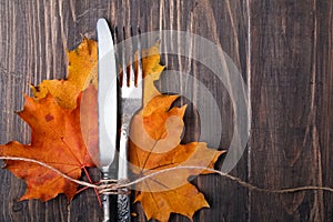 Autumn leaves, knife and fork