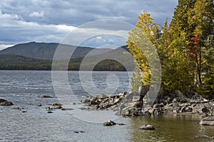 Autumn leaves on rocky shore of Flagstaff Lake, northwestern Mai photo