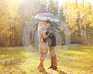 Autumn, love, relationship and people concept - kissing couple