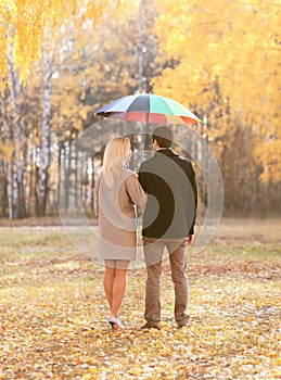 Autumn, love, relationships and people concept - young couple