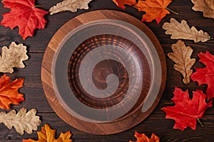 Autumn maple leaves on brown wooden table