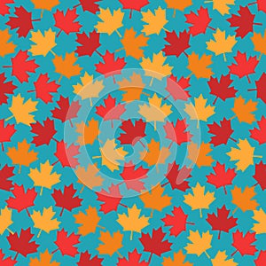 Autumn maple leaves seamless pattern on blue background
