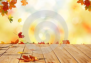 Autumn maple leaves on wooden table.