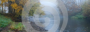 Autumn mist above a river