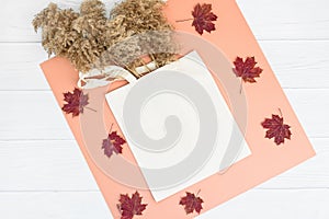 Autumn mockup with tote bag blank and dry reeds on white wood background